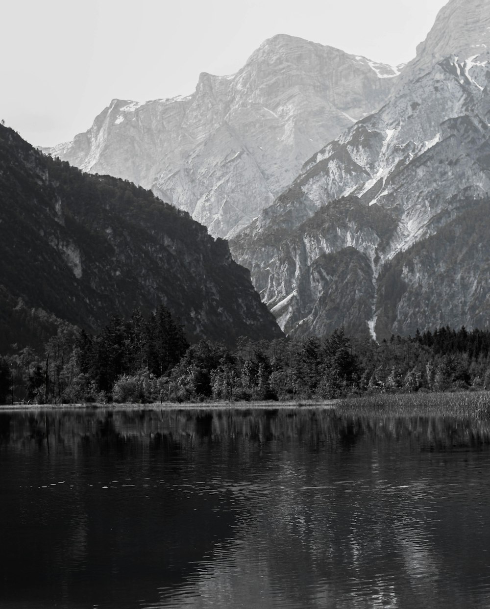 a black and white photo of a mountain range