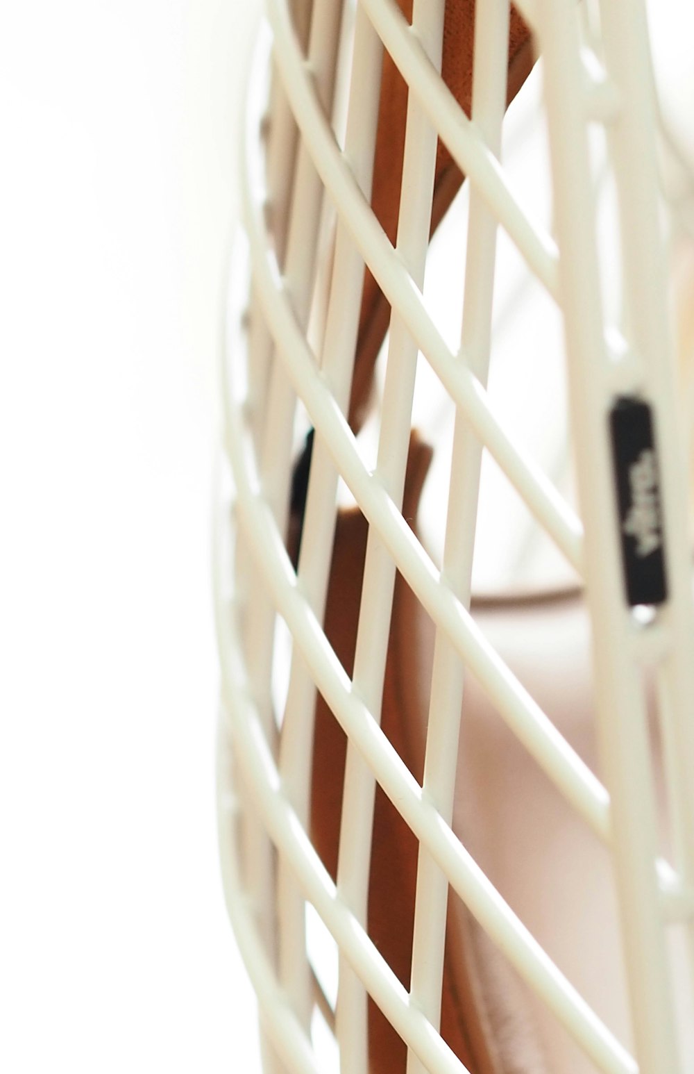 a close up of a tennis racket with a white background