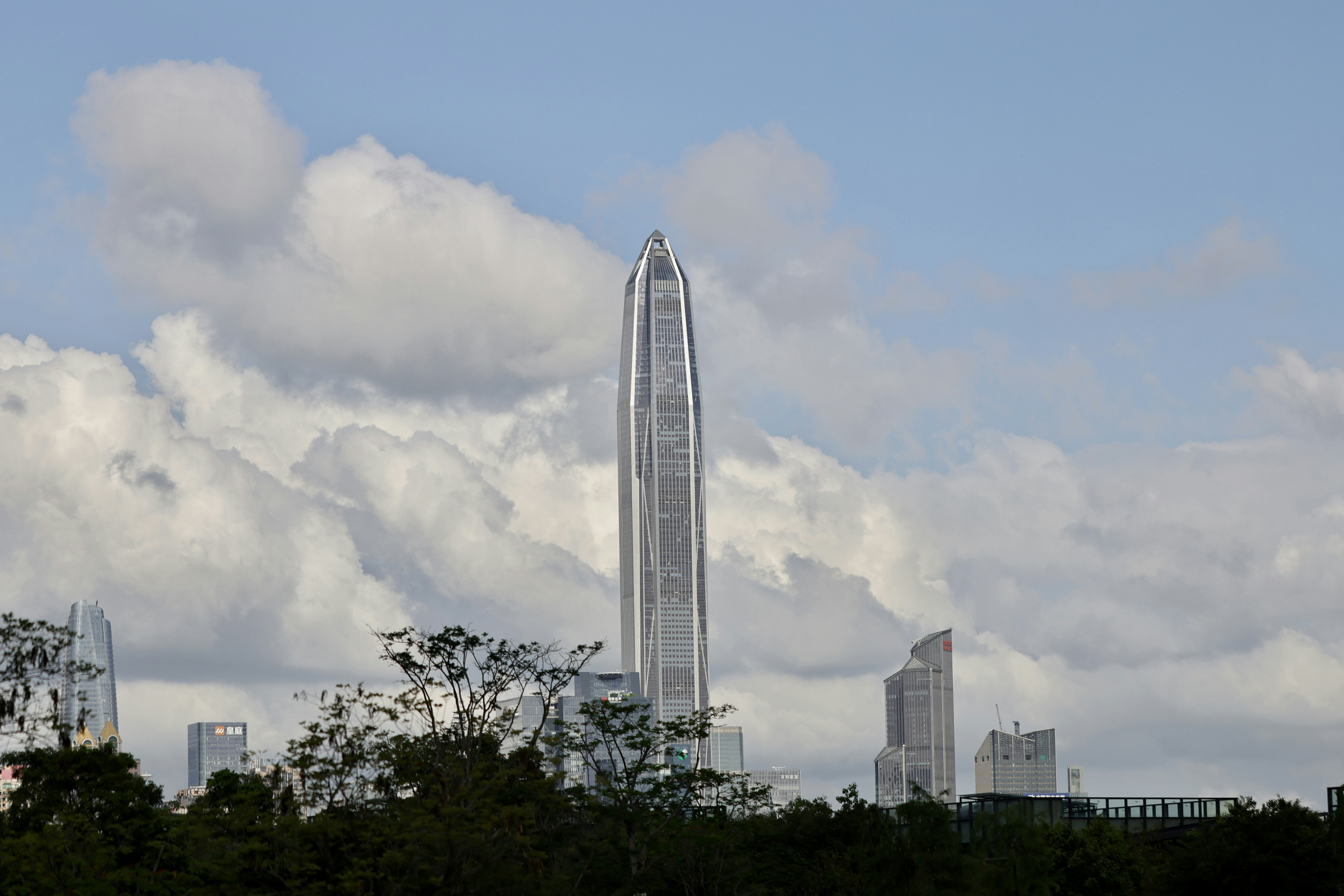 a very tall building towering over a city