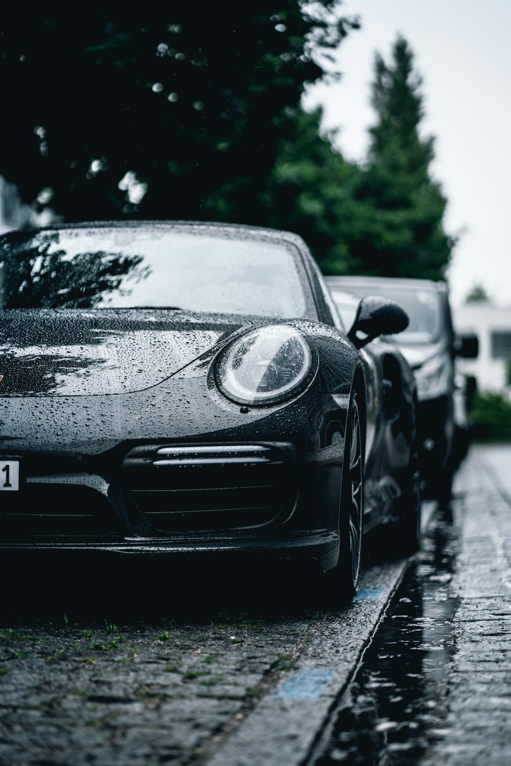 a black sports car parked on the side of the road