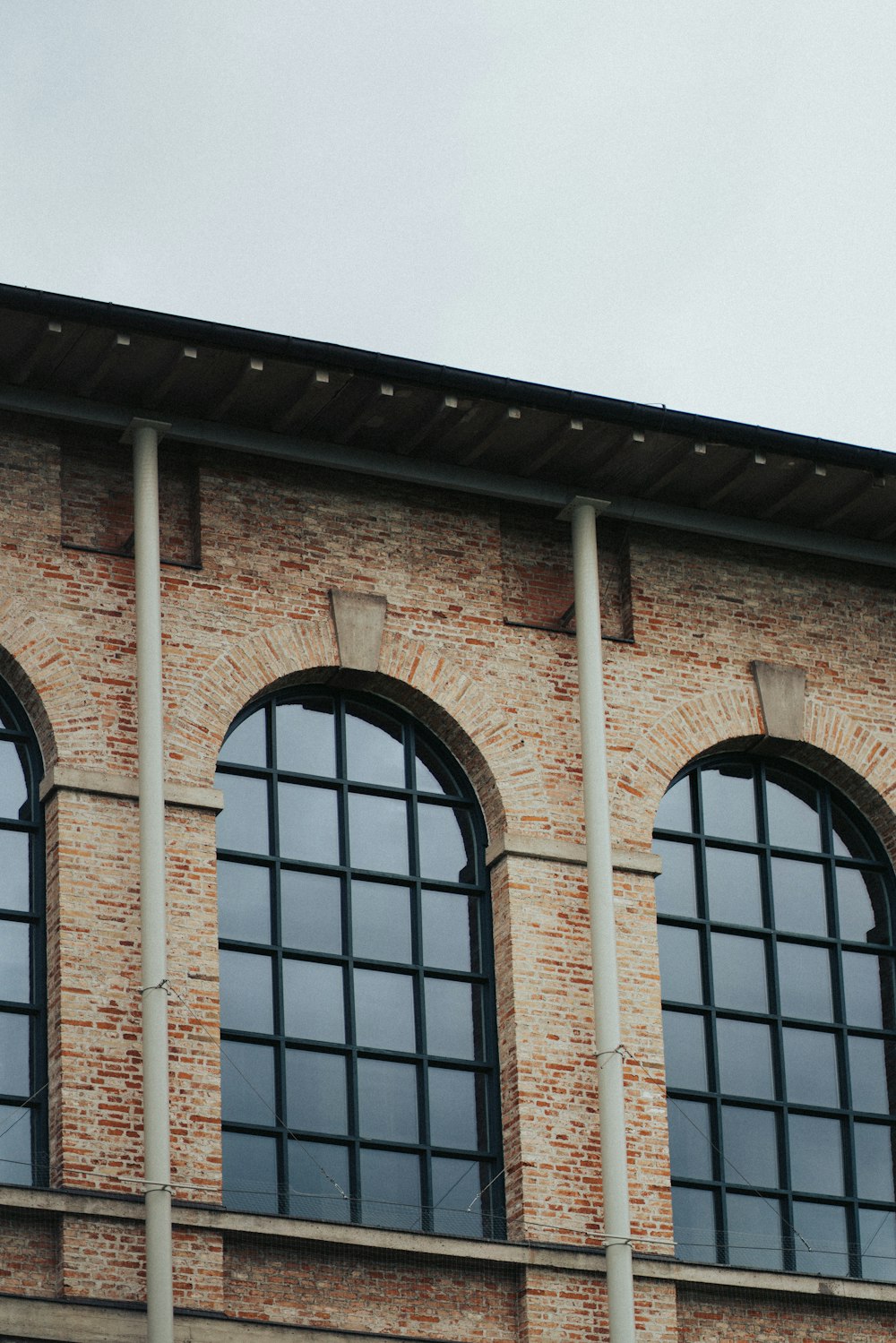 a clock on the side of a brick building