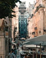 Historic Oradea city center with ornate architecture and lively cafes in the afternoon light