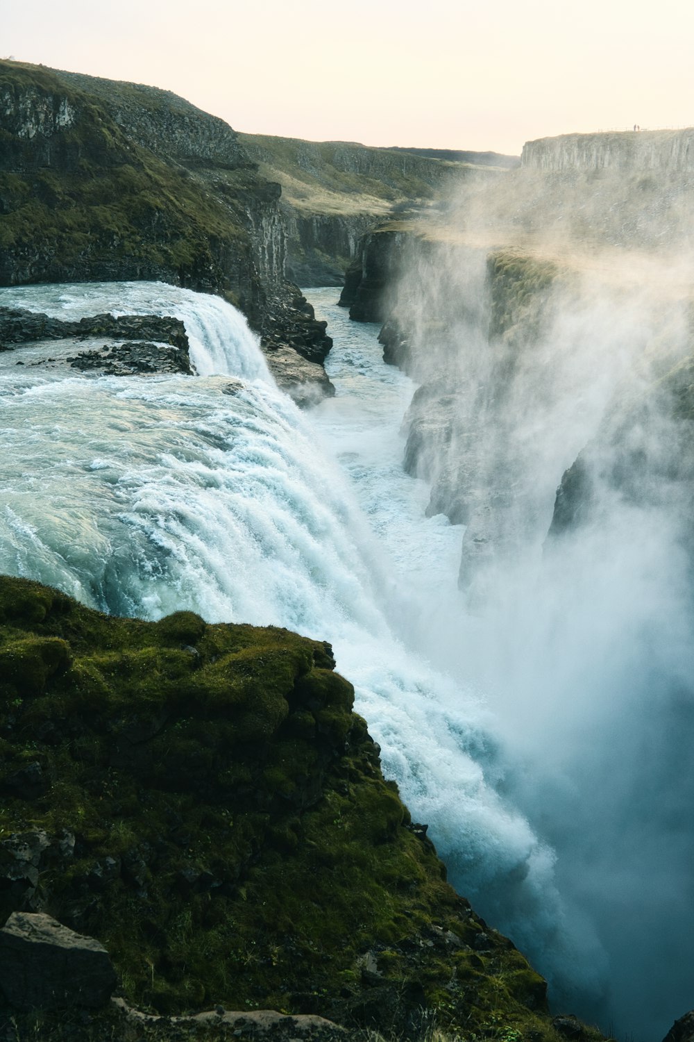 a large waterfall with water pouring out of it