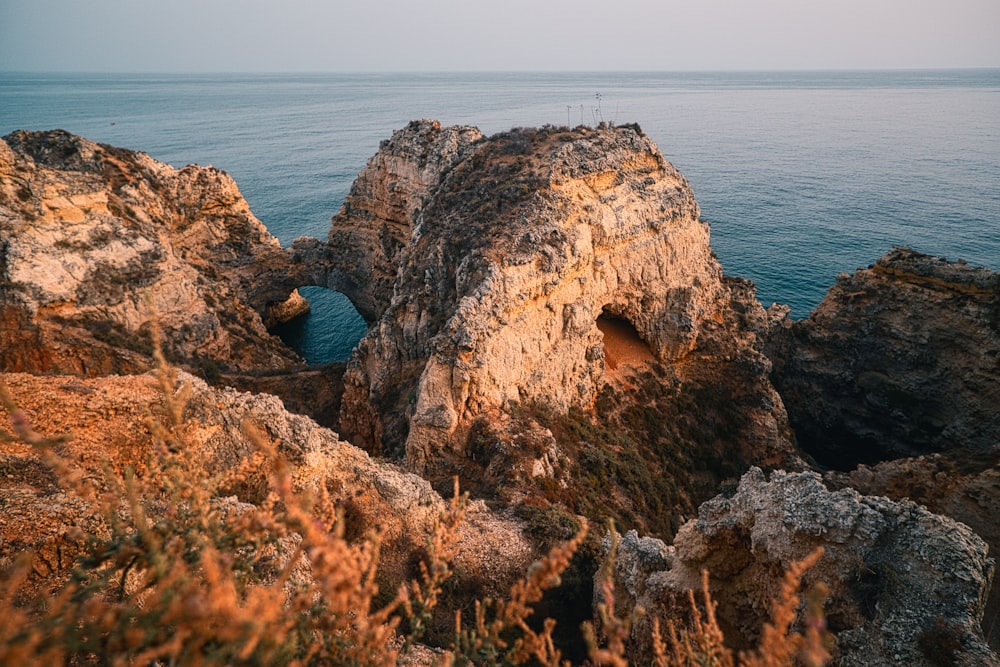 a rocky outcropping in the middle of the ocean