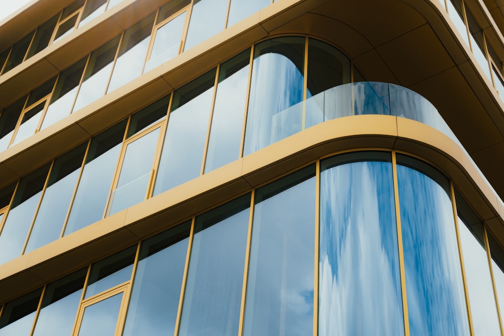 a tall building with lots of windows and a sky background