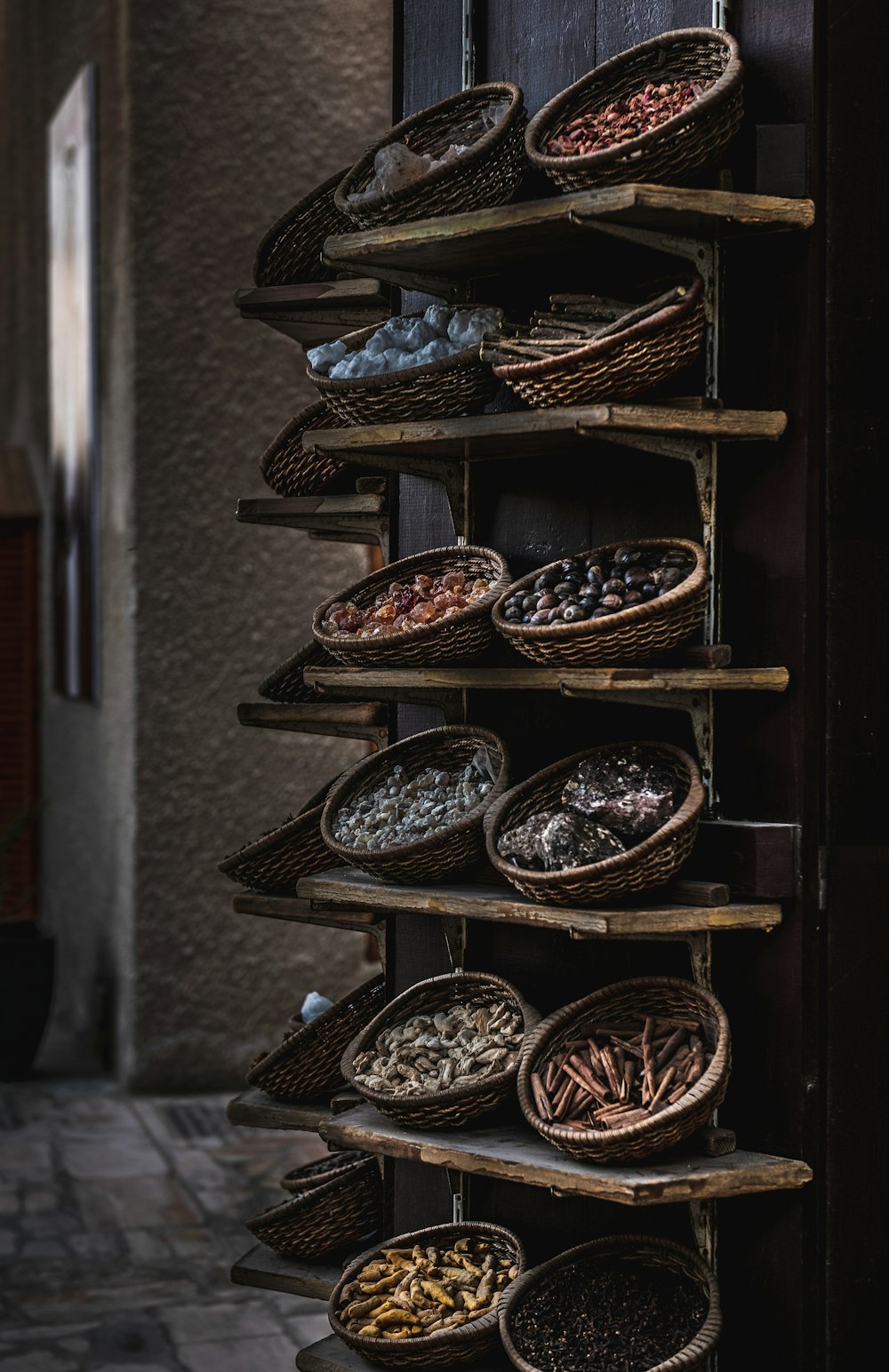 a shelf filled with lots of different types of spices