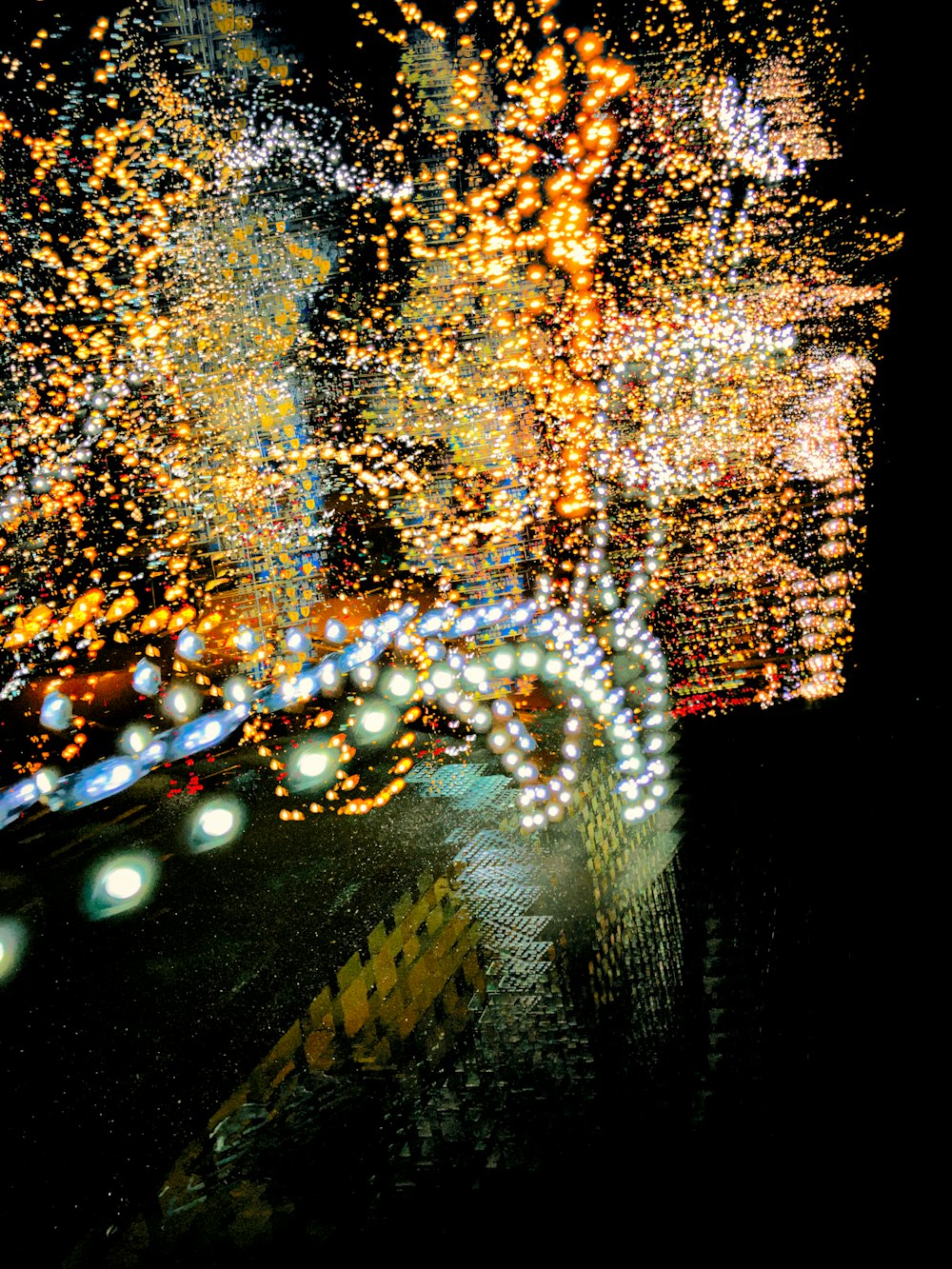 a blurry photo of a city street at night