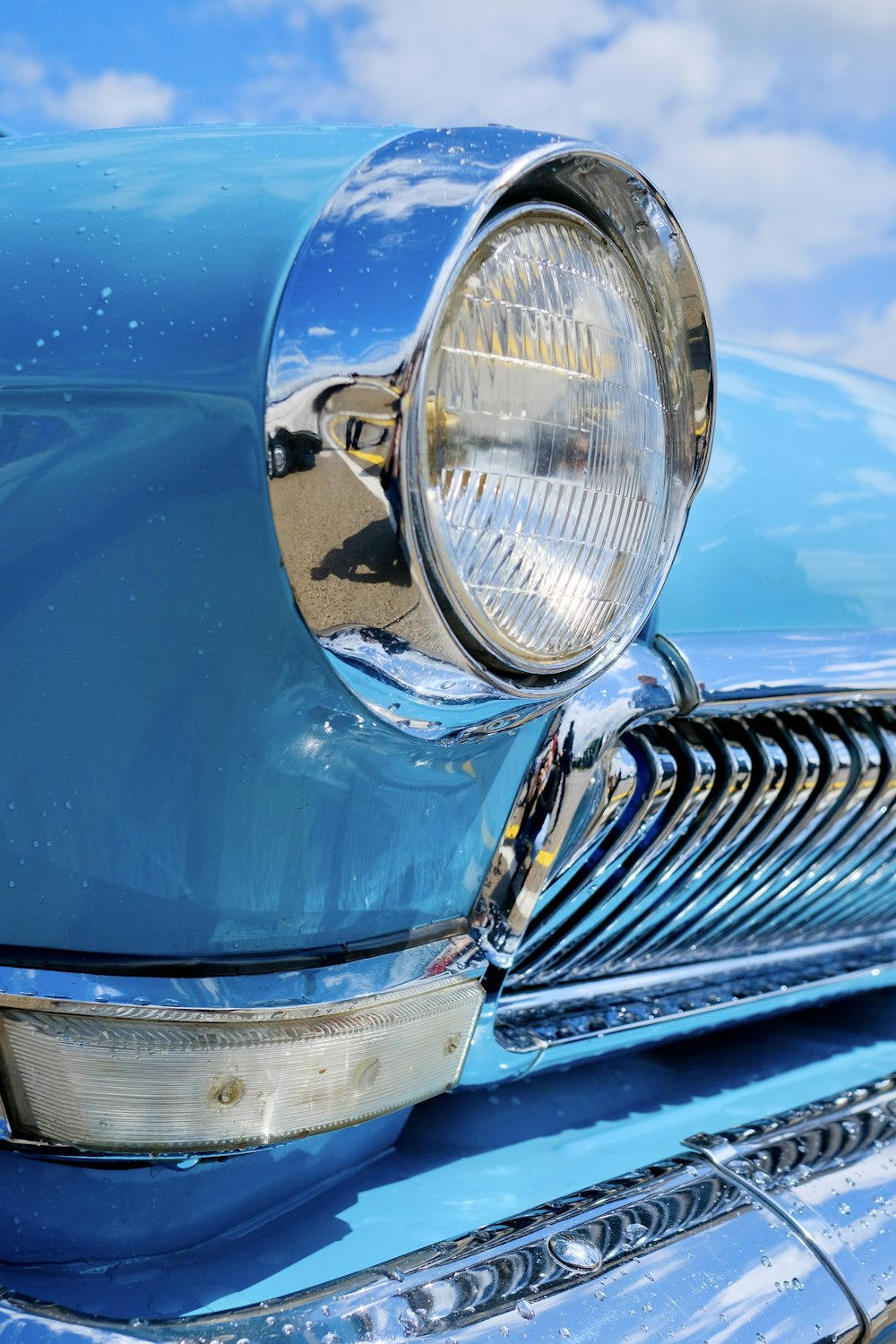 a close up of the front of a classic car