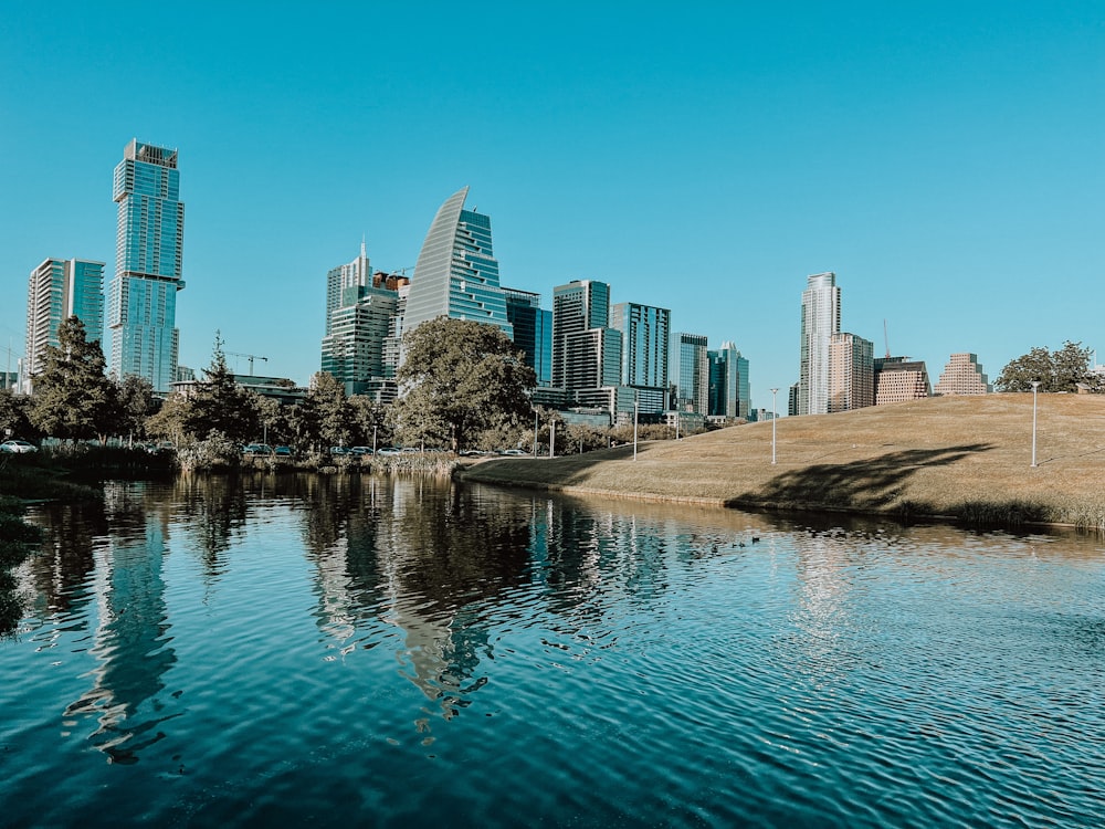 a body of water with a city in the background