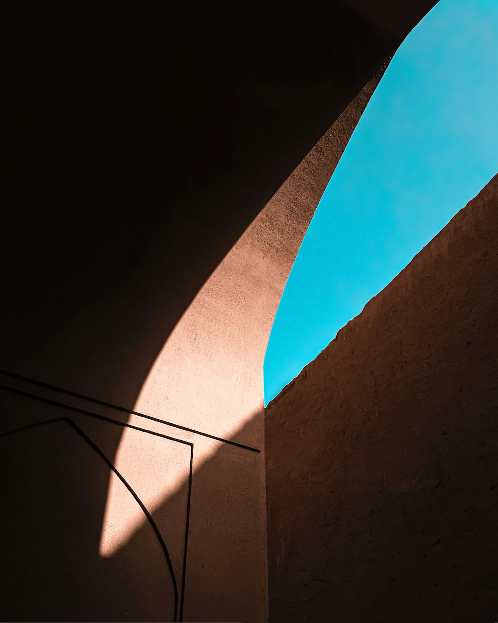 a shadow of a person on a skateboard on a wall