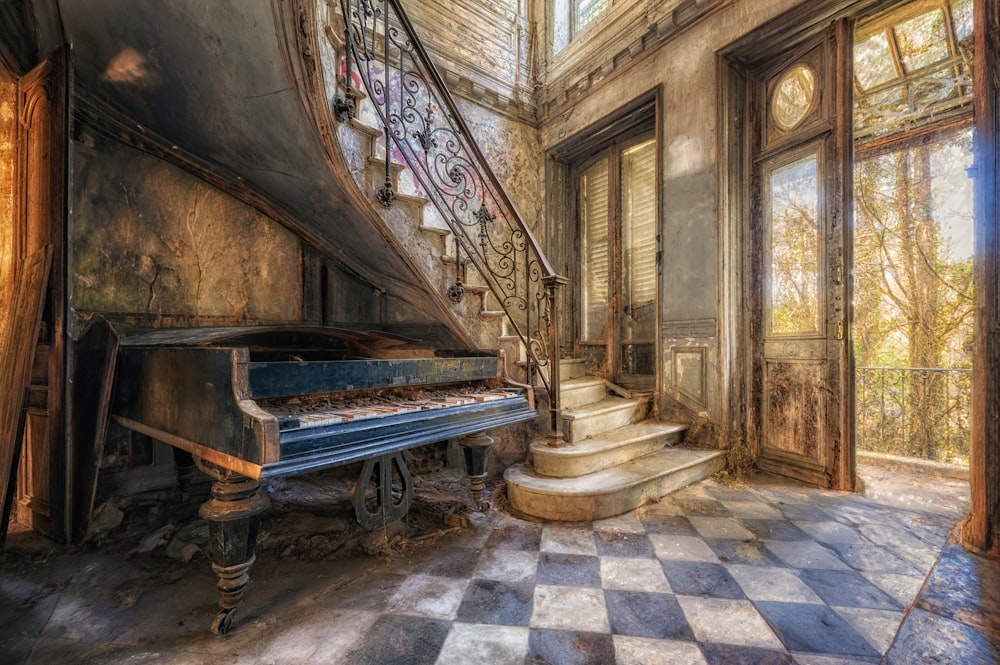 a grand piano in a room with a checkered floor