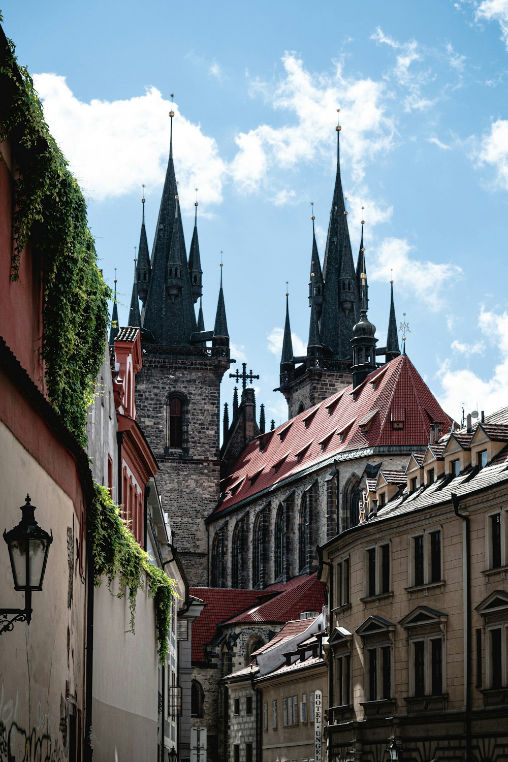 a view of a city street with a church in the background