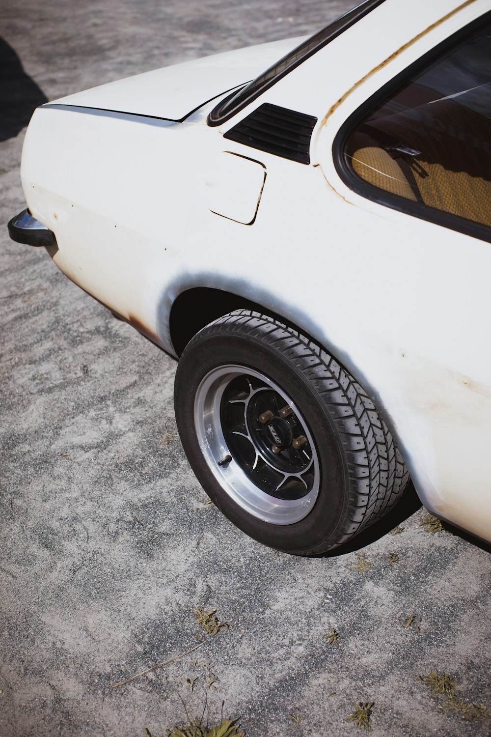 a white car parked on the side of the road