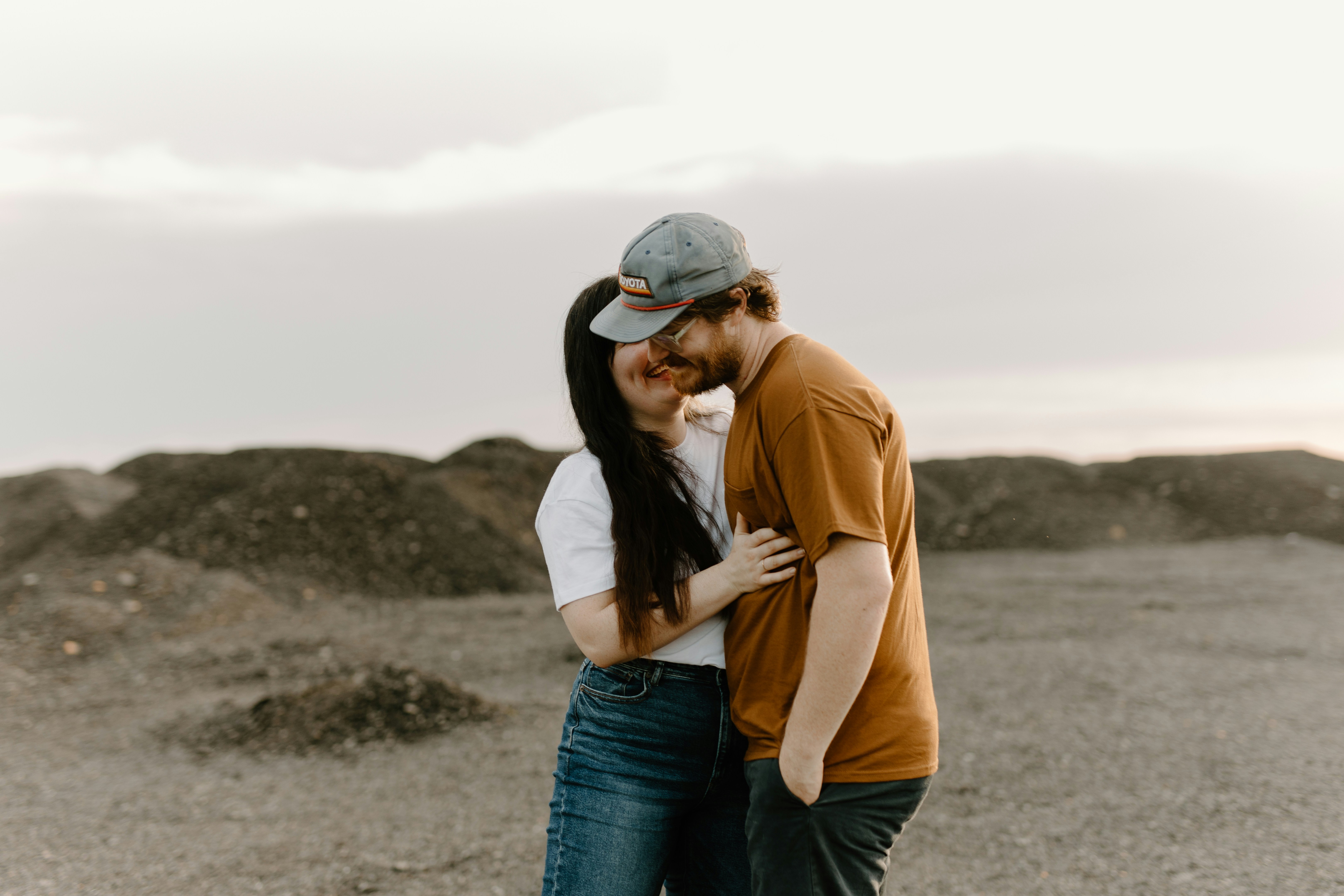 a man and a woman embracing in the desert