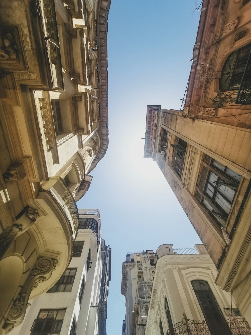 looking up at tall buildings in a city