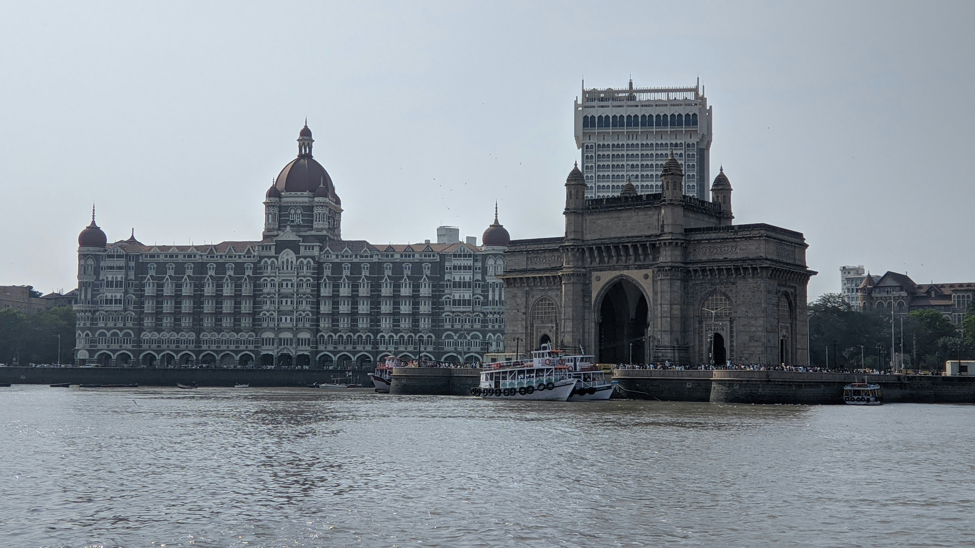a large building sitting on the side of a river