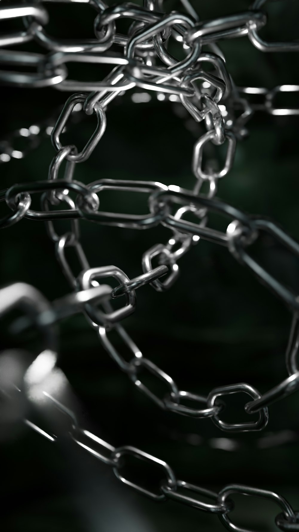 a close up of a metal chain with a blurry background