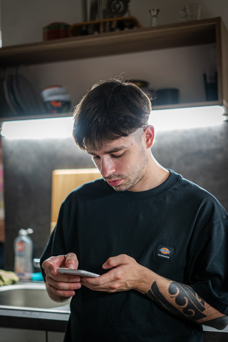 Contractor using a phone app indoors to measure a room