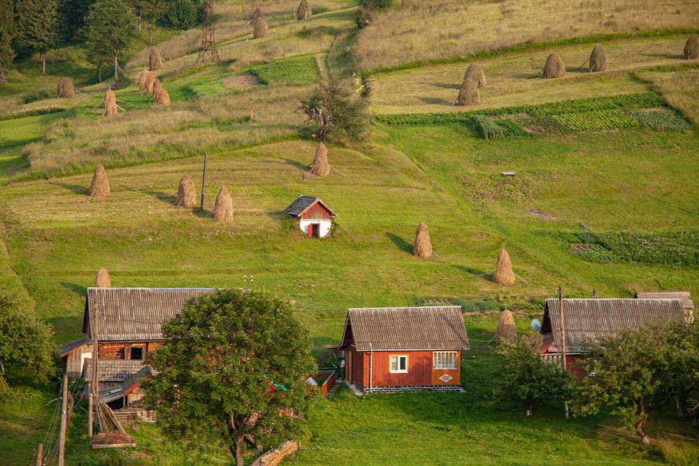 an aerial view of a farm with a small cabin