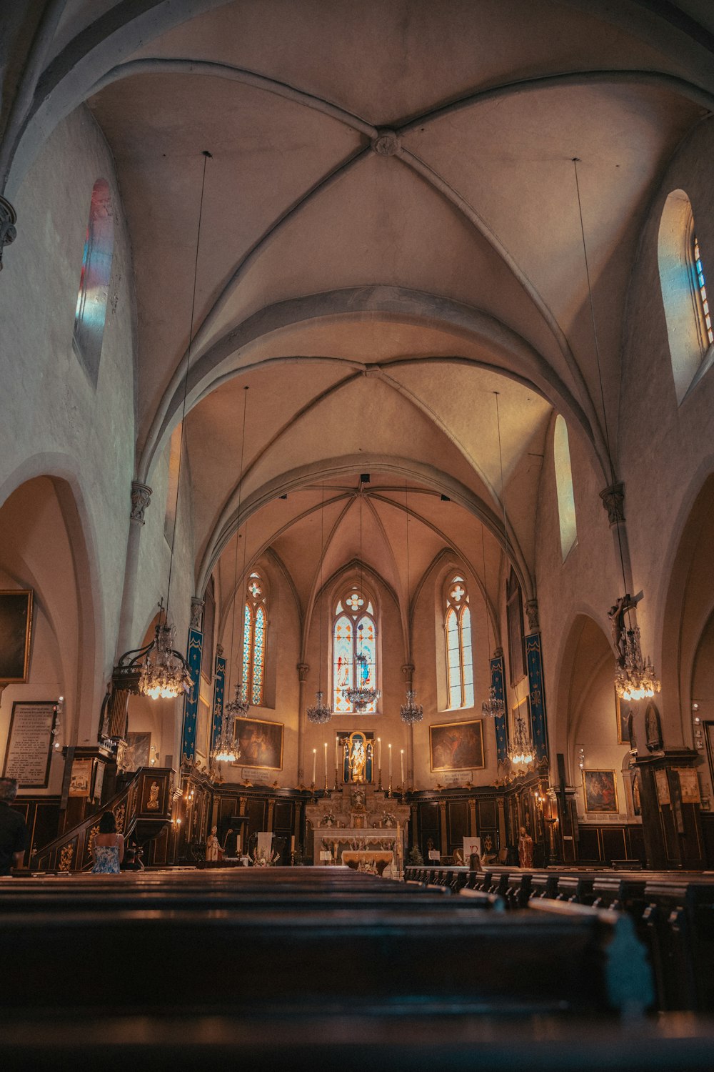 a large cathedral with high vaulted ceilings and stained glass windows