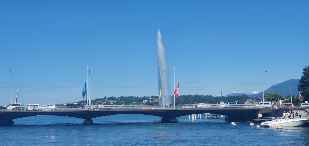 a bridge over a body of water with boats on it