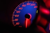 a close up of a speedometer in a car