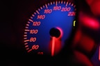 a close up of a speedometer in a car
