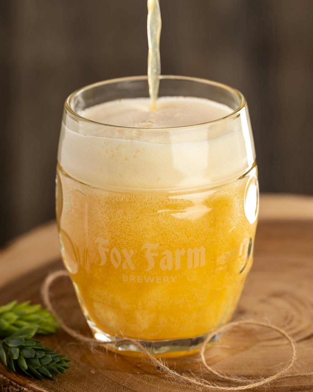 a glass of beer being poured into a glass