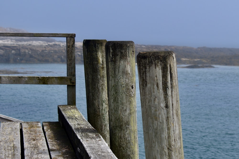 a wooden dock sitting next to a body of water