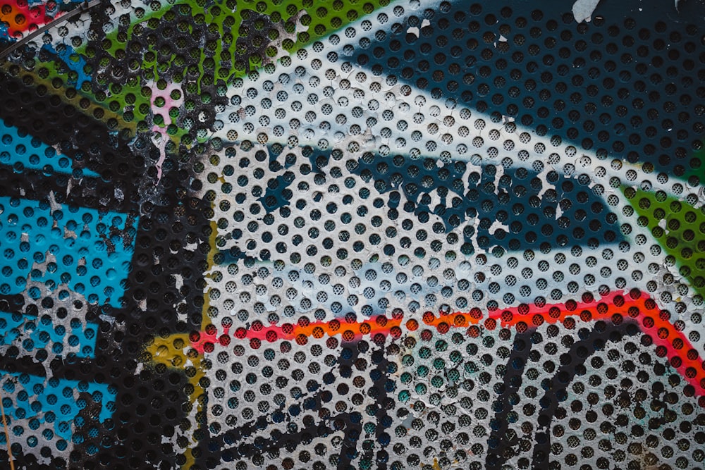 a close up of a wall with a bicycle painted on it