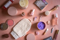 a table topped with lots of different types of cosmetics