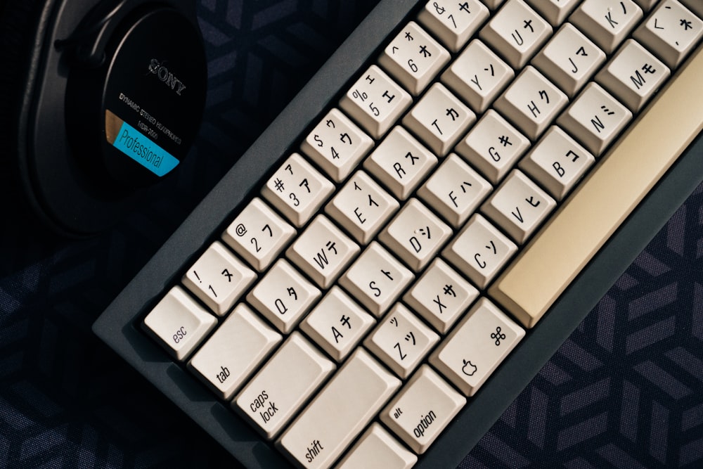 a keyboard and headphones sitting on a table