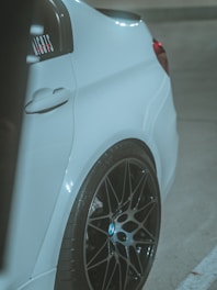 a white car parked in a parking lot