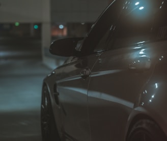 a car parked in a parking lot at night