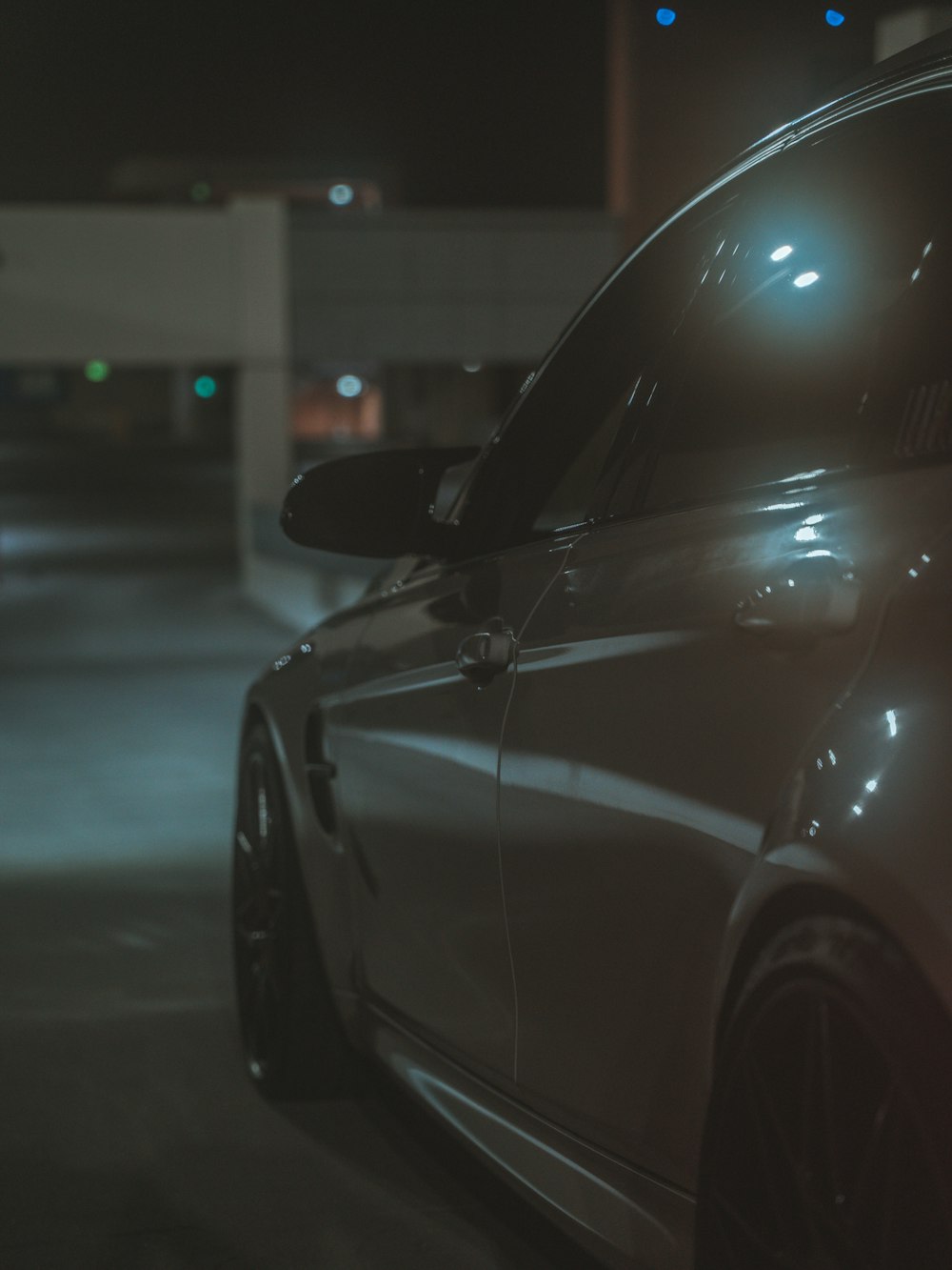 a car parked in a parking lot at night