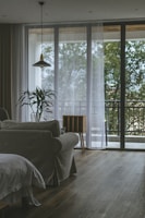 Cozy living room with bright tropical decor and large windows in a Cartagena apartment.