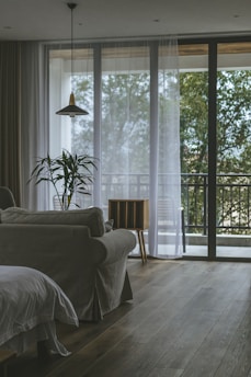 Cozy living room with a clean sofa and bright terrace after professional cleaning.