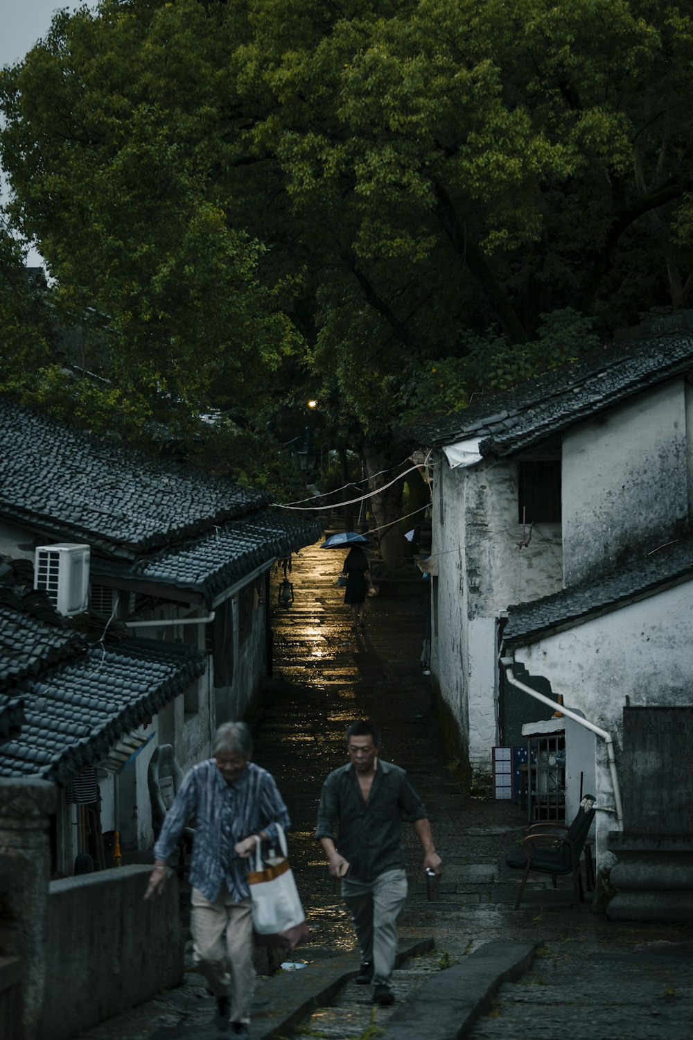 a couple of men walking down a street