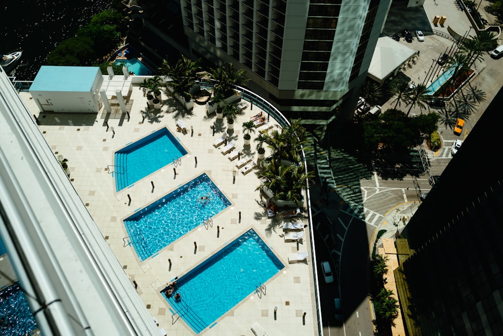 an aerial view of a swimming pool in a city