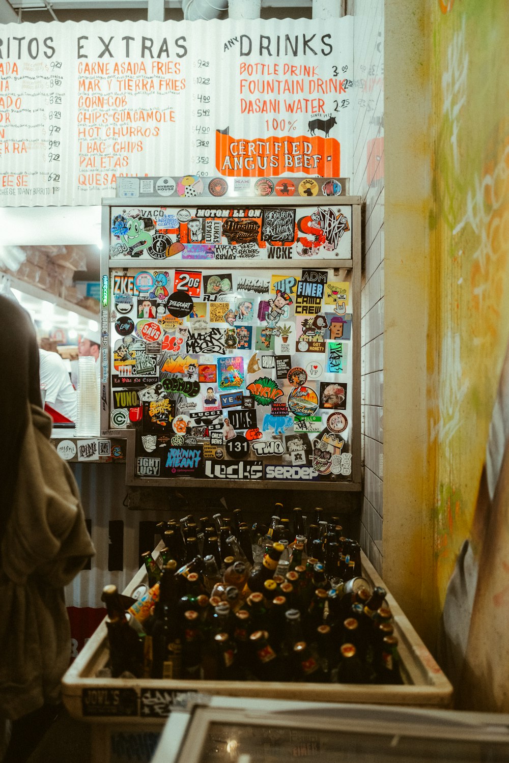 a man standing in front of a vending machine