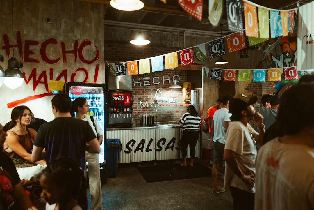 Mexican taco bar with people – customer acquisition - Photo by Daniel Lee | best digital marketing - London, Bristol and Bath marketing agency