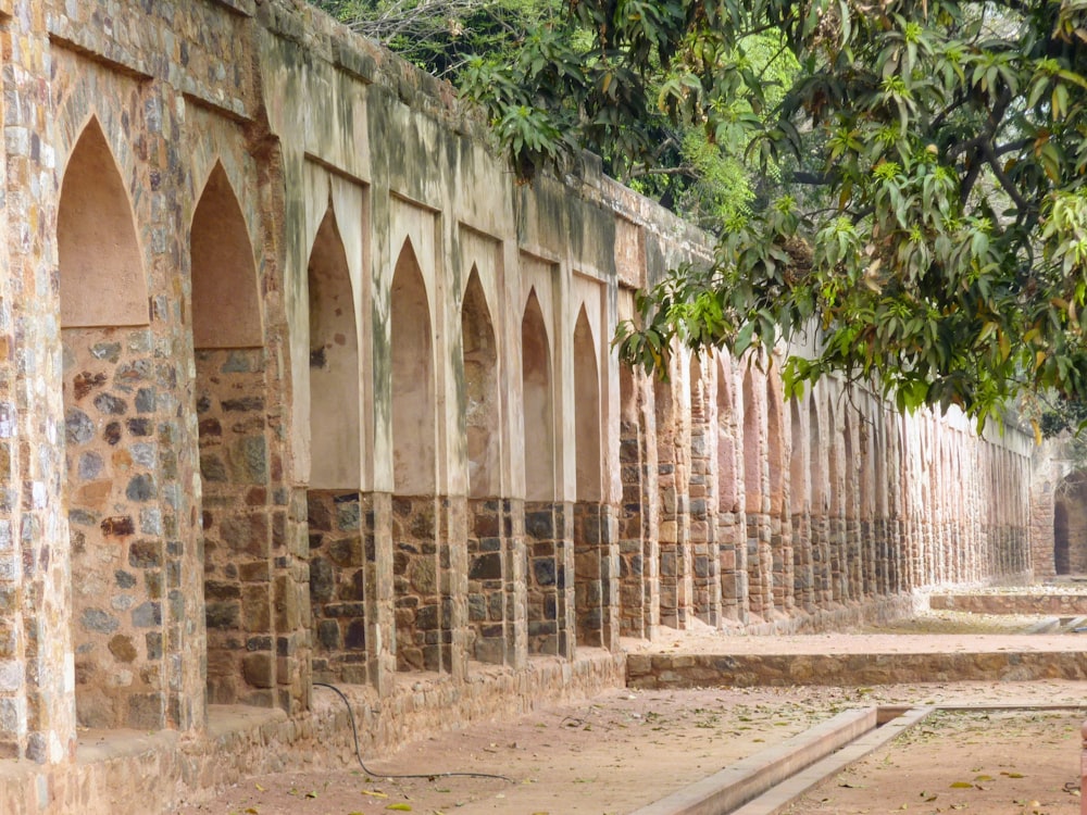 a stone building with arches and arches on the side of it