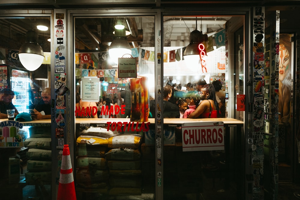 a group of people sitting at a table in a restaurant