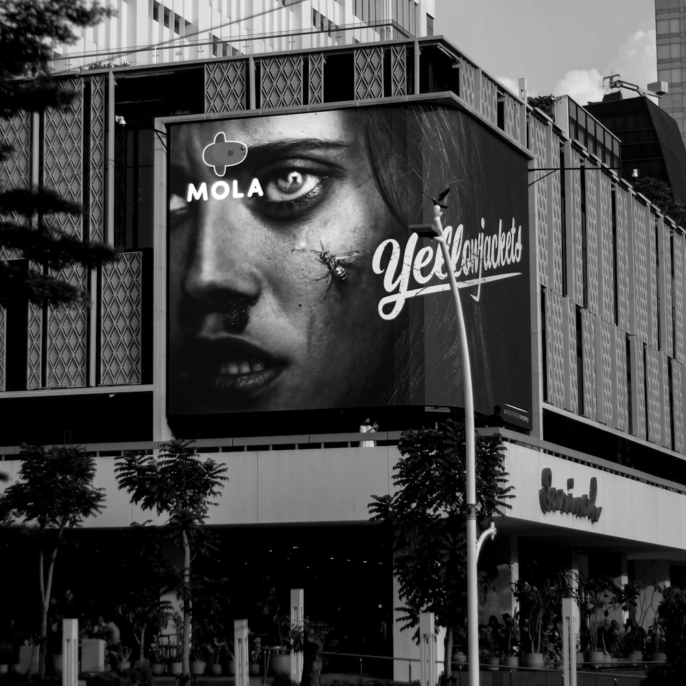 a black and white photo of a large billboard