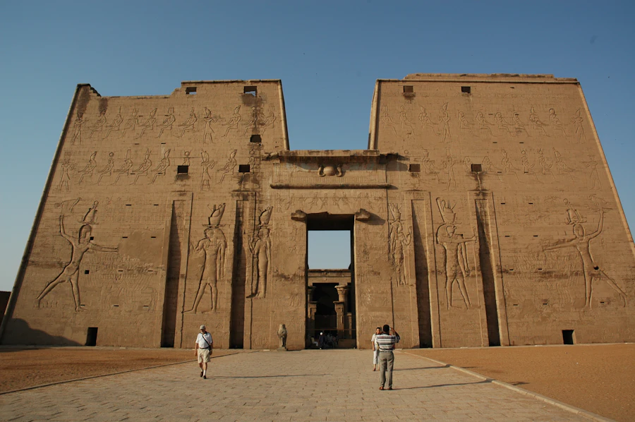 Visitors in front of the Grand Egyptian Museum's entrance plaza