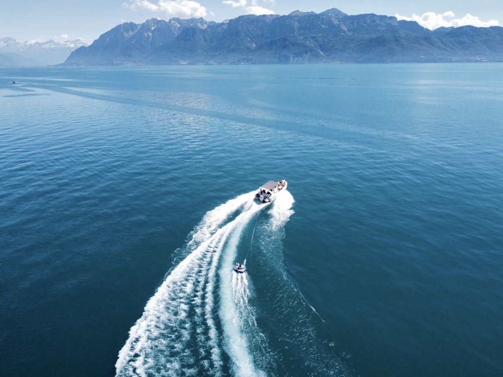 a boat traveling across a large body of water