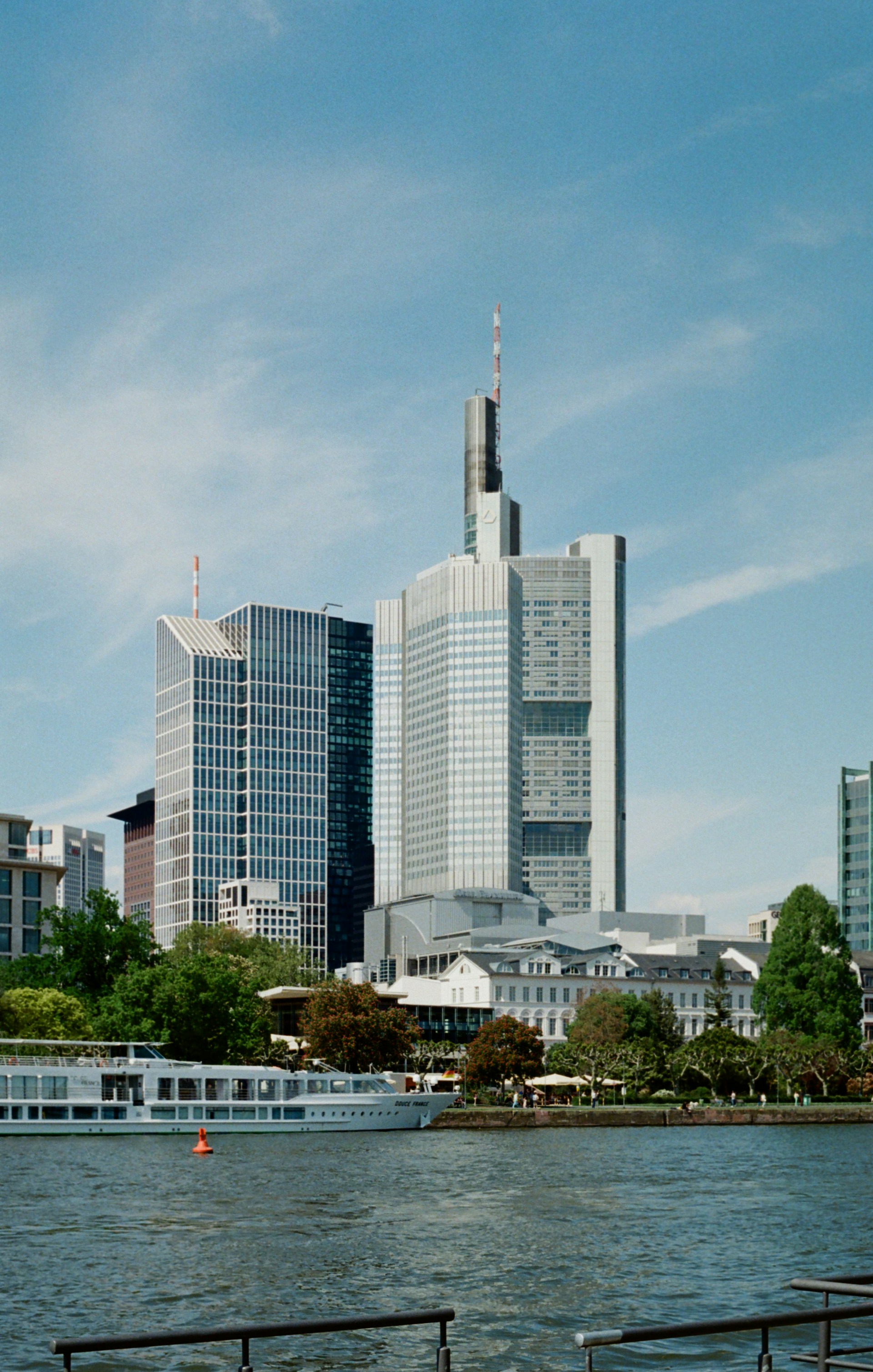a large body of water with a city in the background