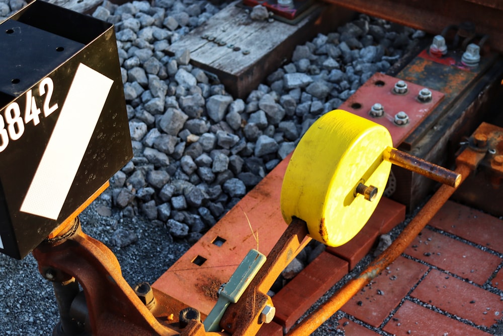 a close up of a yellow and black machine