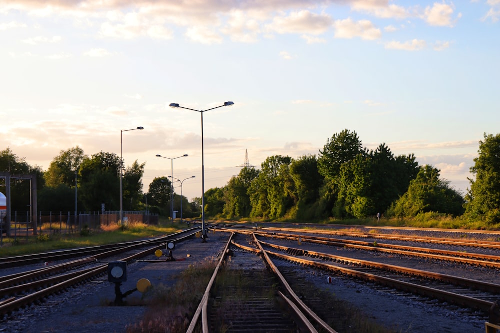 a set of train tracks next to a train station