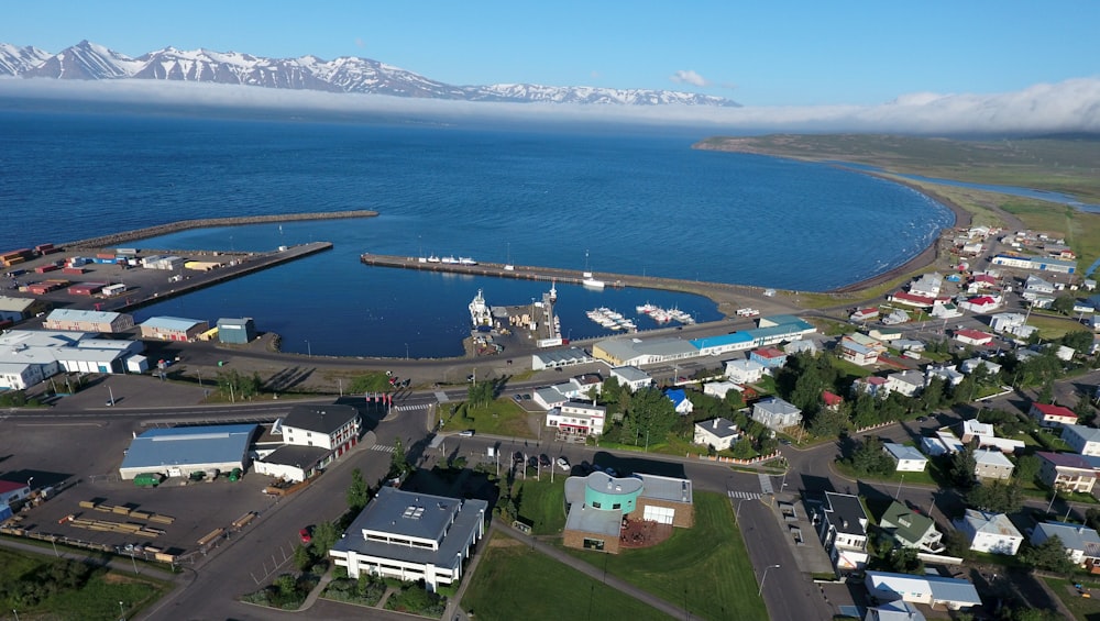 an aerial view of a town and a body of water